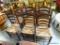 (R3) SET OF 6 ANTIQUE PENCIL POST LADDER BACK CHAIRS WITH RUSH SEATS. THE CHAIRS MEASURE 17 IN WIDE,