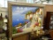 (R6) LARGE OIL ON CANVAS OF A POSSIBLY SPANISH? STREET SCENE BY THE OCEAN. IN SILVER FRAME: 55