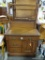 (R1) ANTIQUE OAK WASHSTAND WITH TOWEL BAR. DRAWERS HAVE BRASS PULLS: 32