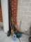 NICE LOT OF YARD TOOLS TO INCLUDE AXE SQUARE NOSE SHOVEL BROOM RAKES PICK TO WATERING CAN AND AND A