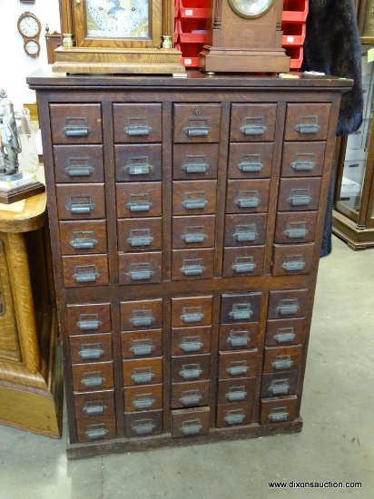 (R1) LARGE ANTIQUE OAK FILING CABINET. EACH DRAWER HAS SLOTS FOR SEPARATION. HAS 50 DRAWERS TOTAL.