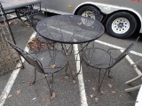 VINTAGE BLACK WROUGHT-IRON AND MESH 5 PIECE PATIO SET. THE TABLE MEASURES 35