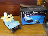 (R2) JIM BEAM GOLF CART DECANTER WITH ORIGINAL BOX. 5'' X 10'' X 7'' IS IN GOOD CONDITION