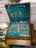 (R3) COMPLETE SOLID BRONZE DININGWARE SET IN WOODEN SILVERWARE BOX. DINING WARE STILL HAS MOST OF