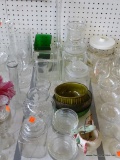(TABLE) LOT OF GLASSWARE: VASES. BUD VASES. LIDDED CANISTERS. ETC.