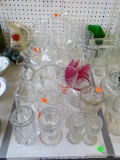 (TABLE) LOT OF GLASSWARE: VASES. BUD VASES. BEER GLASS. SEAGRAM'S DRINK POURERS. ETC.