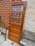 VINTAGE WOOD EXTERIOR DOOR WITH3 LIGHTS AT THE TOP, BRASS LOCK SET AND HINGES.