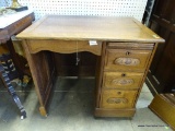 (R1) ANTIQUE OAK CHILDS SCHOOL DESK WITH RAISED PANEL DRAWER HANDLES. HAS 4 DRAWERS WITH DOVETAIL.