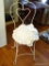 (DR) WHITE METAL VANITY CHAIR WITH REMOVABLE CUSHION. HAS A HEART SHAPED SPLAT: 16