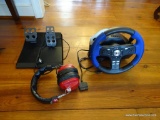 (LR) LOGITECH STEERING WHEEL CONTROLLER AND FOOT PEDALS FOR A PLAYSTATION RACING GAME. INCLUDES A