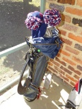 (PORCH) LEATHER GOLF BAG ON ROLLING GOLF CADDY WITH CLUBS: 3 DRIVERS. 7 WEDGES. 3 PUTTERS.