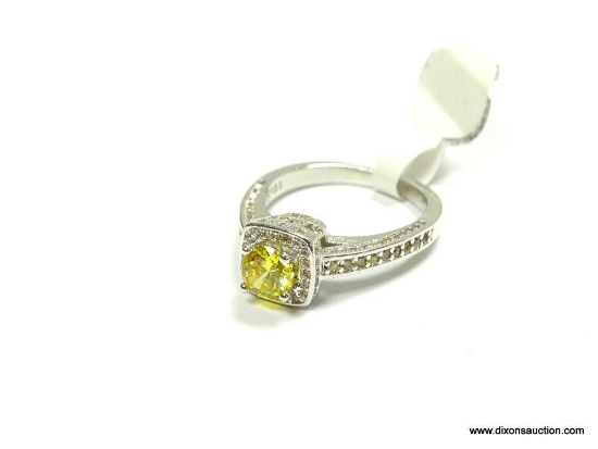 .925 STERLING SILVER FACETED RANE LEMON CITRINE RING SURROUNDED BY WHITE TOPAZ ACCENTS. SIZE 8