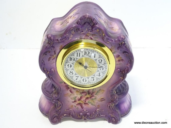 PURPLE CHINA CLOCK WITH NEW QUARTZ INSERT. CASE DOES HAVE CRACK AND CHIP. MEASURES 11.75"T X 10.5"W