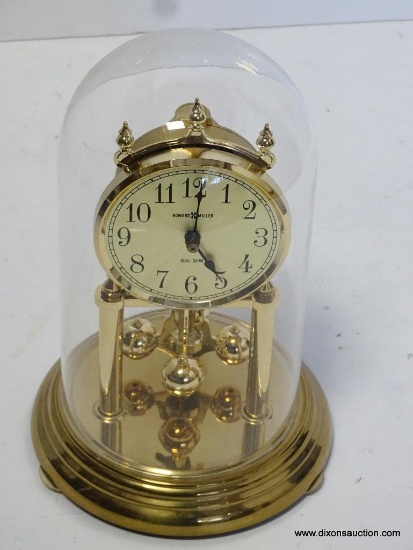 HOWARD MILLER QUARTZ ANNIVERSARY CLOCK UNDER DOME WITH CHIME. MEASURES 9"T X 6"W RETAIL PRICE $150