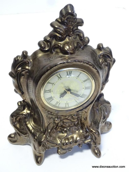 CERAMIC ELECTRIC CLOCK. MEASURES 11.5"T X 8"W RETAIL PRICE $35