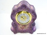 PURPLE CHINA CLOCK WITH NEW QUARTZ INSERT. CASE DOES HAVE CRACK AND CHIP. MEASURES 11.75