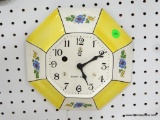 GERMAN YELLOW AND WHITE PLATE CLOCK WITH 8-DAY TIME. MEASURES 9