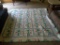 (1ST FLR BR) LARGE FLORAL PATTERNED BLANKET. INCLUDES MATCHING PILLOW SHAM.