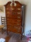 (2ND FLR BR 2) MAHOGANY QUEEN ANNE 6 DRAWER TALL CHEST WITH BROKEN ARCH PEDIMENT AND FINIAL. HAS