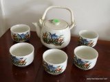 (2ND FLR MASTER BR) FLORAL PAINTED TEA SET WITH TEAPOT AND 5 TEA CUPS.