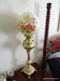 (2ND FLR MASTER BR) VINTAGE BRASS BANQUET LAMP CONVERTED TO ELECTRIC WITH PAW FEET, FLORAL PAINTED