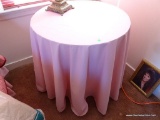 (2ND FLR BR 2) WOODEN ROUND TABLE WITH CLOTH COVERING: 28