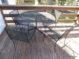 (PORCH) CAST IRON AND MESHED WIRE PATIO TABLE WITH 4 CHAIRS. TABLE IS: 47.5