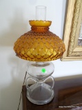 (SUNROOM) 2 HANDLED OIL LAMP CONVERTED TO ELECTRIC WITH AMBER GLASS SHADE. HAS CHIMNEY: 11