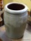 (A1) STONEWARE CROCK WITH RIM CHIP. 10'' TALL