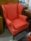 (A5) RED UPHOLSTERED BALL AND CLAW FOOTED WING CHAIR: 33