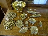(A3) VIRGINIA METALCRAFTERS BRASS LOT. INCLUDES 2 TRIVETS, 8 LEAF DISHES, 1 BRASS KEY, A MADE IN