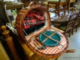 (A4) QUALITY PICNIC BASKET WITH CONTENTS. INCLUDES 4 CUPS, 4 PLATES, AND SILVERWARE.