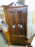 (A1) DIMINUTIVE MAHOGANY CORNER CABINET. 2 DOORS OVER 2 DOORS. LOCKS AND KEY IS PRESENT. VGC