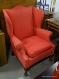 (A5) RED UPHOLSTERED BALL AND CLAW FOOTED WING CHAIR: 33