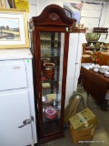 (A6) MAHOGANY CURIO CABINET WITH SHELL CARVING AT THE CREST. HAS 4 GLASS SHELVES AND LIGHTED