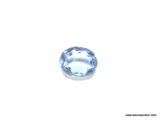 8.07 CT. OVAL CUT BLUE TOPAZ. MEASURES APPROX. 15 BY 12 BY 6MM.