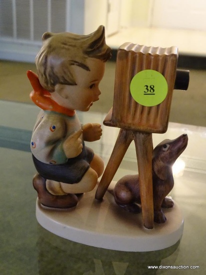 (LR) GOEBEL HUMMEL FIGURINE OF A BOY TAKING A PHOTO WITH HIS DOG: 5" TALL