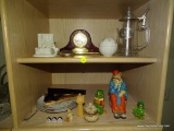 (LR) 2 SHELF LOT: HOWARD MILLER MANTEL CLOCK. PICTURE HOLDERS. IRISH GARFIELD FIGURINE. SITTING