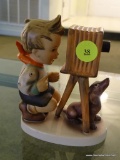 (LR) GOEBEL HUMMEL FIGURINE OF A BOY TAKING A PHOTO WITH HIS DOG: 5