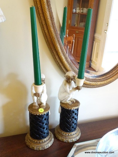 (DR) PAIR OF WHITE AND BROWN MONKEYS ON PILLARS STYLE CANDLESTICK HOLDERS: 1' TALL