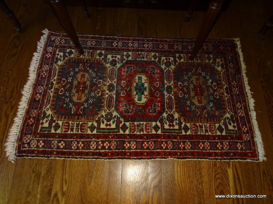 (LR) ANTIQUE HANDMADE ORIENTAL RUG IN RED AND CREAM: 45"x26". MADE IN IRAN. EACH MEDALLION HAS 4