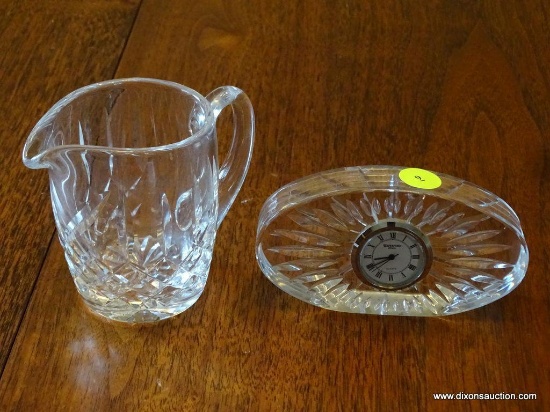 (DR) 2 PIECES OF SIGNED WATERFORD CRYSTAL: 1 CRYSTAL CREAMER AND 1 QUARTZ WATERFORD CLOCK ENCASED IN