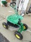 (OUT) JOHN DEERE COLOR PAINTED PULL-ALONG SCOOTER WITH TRACTOR STYLE SEAT: 31