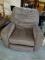 (ROW 5) BROWN UPHOLSTERED ROCKING, SWIVEL, AND RECLINING ARM CHAIR. IN EXCELLENT CONDITION: