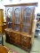 (ROW 2) BASSETT FURNITURE CO. 2 PIECE CHINA CABINET WITH 3 UPPER PANED GLASS DOORS AND 2 DRAWERS