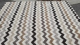 (ROW 1) BRAIDED RUG IN ZIG ZAG BROWN, GRAY, AND CREAM PATTERN: 9' 11