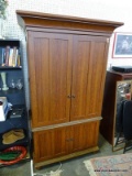 (ROW 5) CHERRY ENTERTAINMENT UNIT WITH 2 LOWER DOORS. UPPER DOORS OPEN TO REVEAL A TV STAND WITH