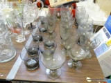 (TABLE ROW 1) 25 PIECES OF SMOKED GLASS GLASSWARE: JUICE GLASSES, WATER GLASSES, HIGHBALL GLASSES,