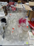 (TABLE ROW 2) LARGE LOT OF VASES AND RED WINE STEMS