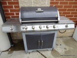 (OUT) BRINKMAN OUTDOOR GRILL WITH TEMPERATURE GAUGE ON THE TOP, 2 LOWER DOORS, AND 2 SIDE BURNERS.